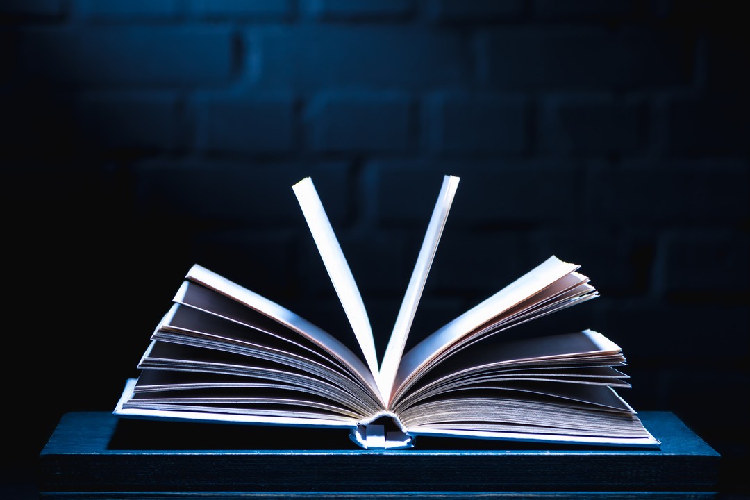 Open book with illuminated pages